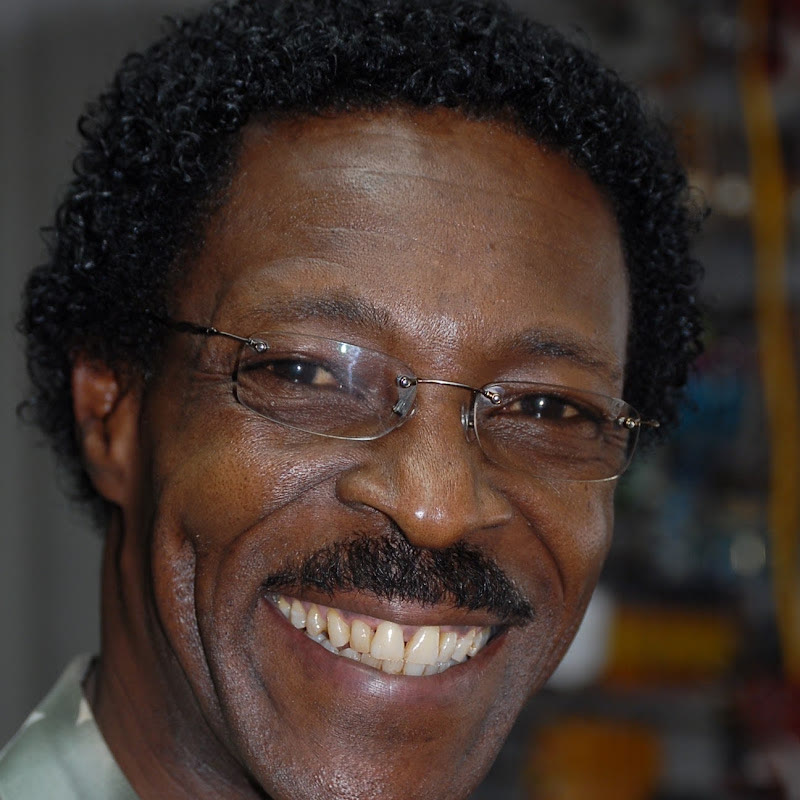Close portrait of Roman Paul smiling in eyeglasses