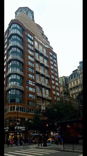 Low-angle view of a brick New York City building and street corner